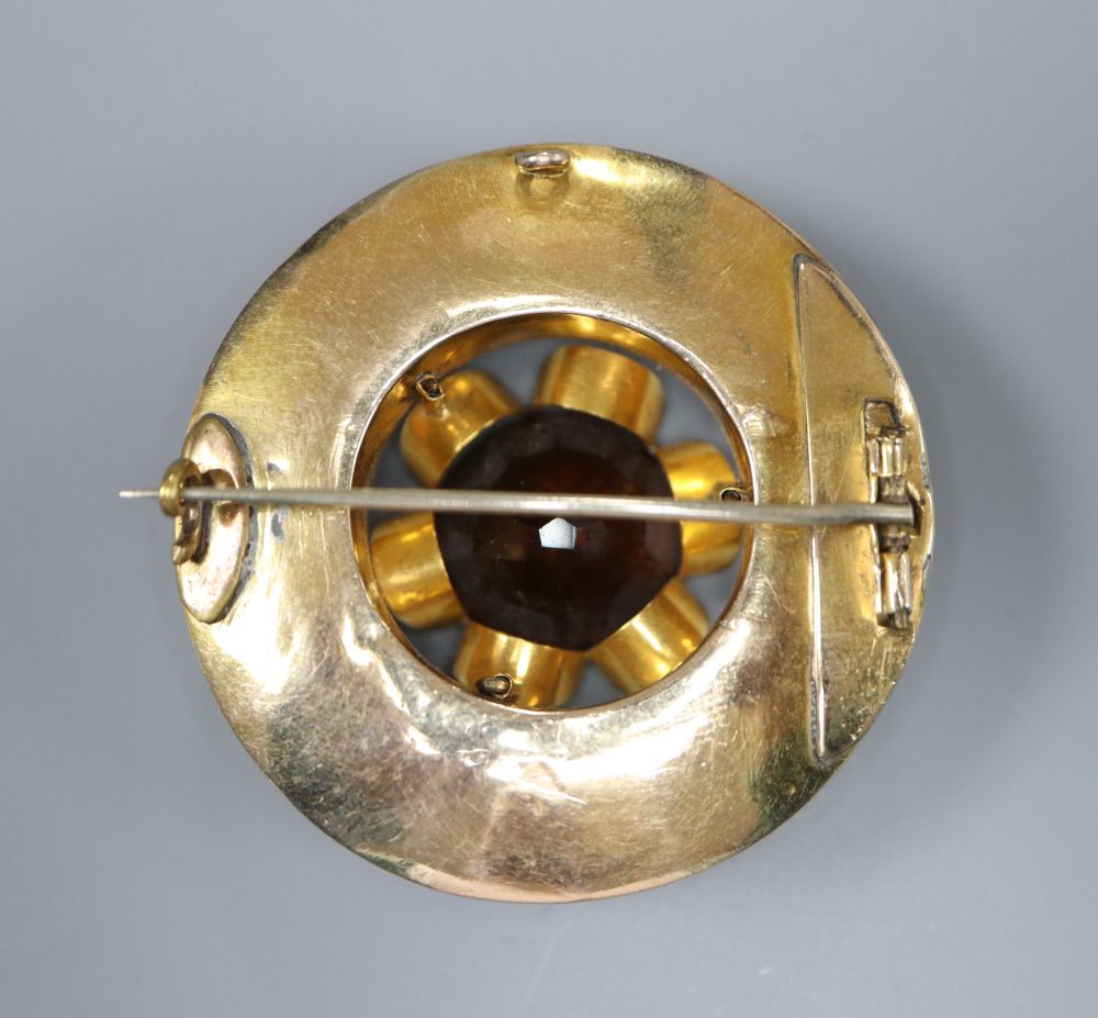 A Victorian yellow metal, citrine and Scottish hardstone set circular brooch, 48mm, gross 32.6 grams.